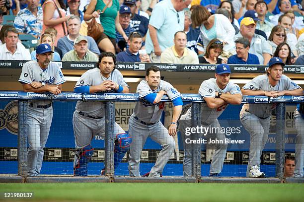 Los Angeles Dodgers coach Trey Hillman , Rod Barajas , Jamey Carroll , coach Dave Hansen and Clayton Kershaw in dugout during game vs Milwaukee...