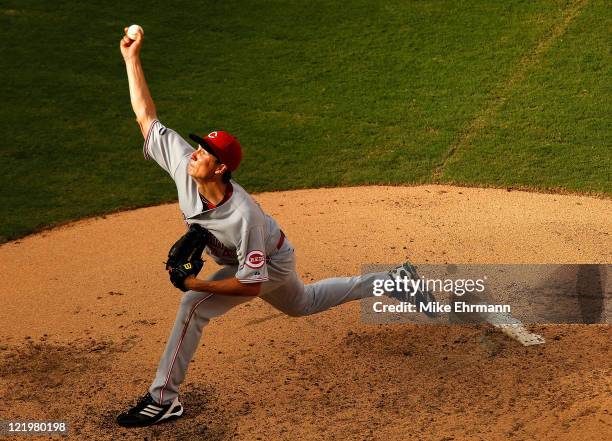 Homer Bailey of the Cincinnati Reds pitches during game one of a doubleheader against the Florida Marlins at Sun Life Stadium on August 24, 2011 in...