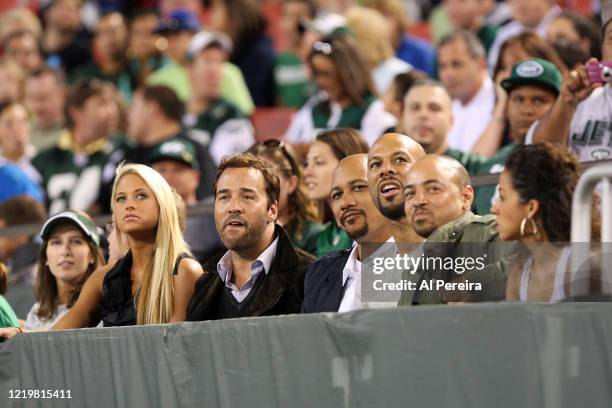 The Rapper Common and Jeremy Piven attend the New York Jets vs Philadelphia Eagles game at The Meadowlands on September 3, 2009 in East Rutherford,...