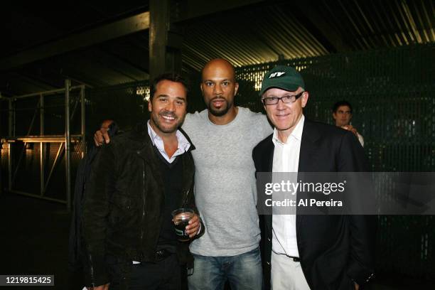 The Rapper Common and Jeremy Piven meet with New York Jets Owner Woody Johnson when they attend the New York Jets vs Philadelphia Eagles game at The...