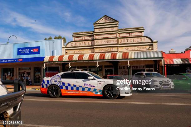 Police car is seen traveling along Marshall Street on April 17, 2020 in Cobar, Australia. For Australians who live in the bush and hundreds of...