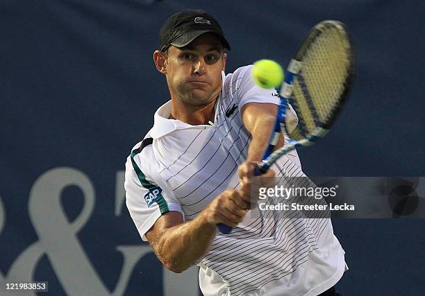 Andy Roddick of the USA returns a shot to Santiago Giraldo of Colombia during the Winston-Salem Open at the Wake Forest University Tennis Complex on...