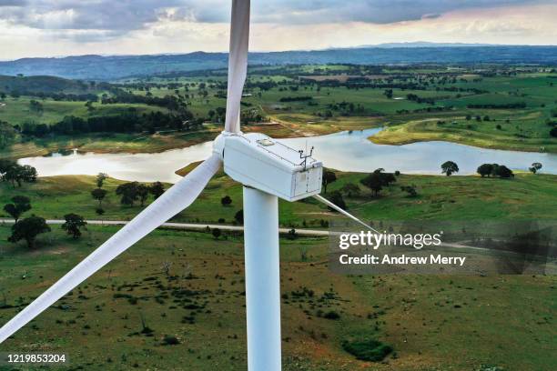 wind turbine, wind farm in green field with lake - wind farm australia fotografías e imágenes de stock