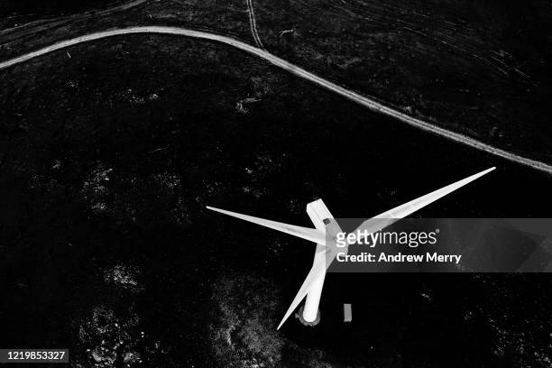 wind turbine and dirt road from above, black and white - wind farm australia fotografías e imágenes de stock