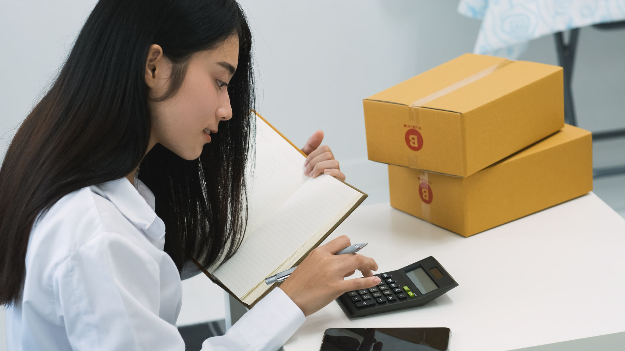 asian online shop seller packing box for sending to customer buy goods from online store.e-commerce for start up small business concept asian online shop seller packing box for sending to customer buy goods from online store.e-commerce for start up small business concept