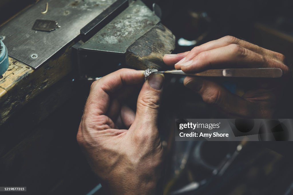 Jeweller's Hands working on Diamond Ring