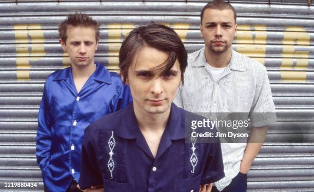 Matthew Bellamy, Dominic Howard and Christopher Wolstenholme of British rock group Muse pose, circa June 1999 as they promote their debut album...