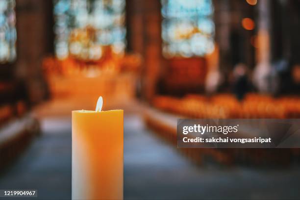 close-up of candle in the church, nuremberg, germany, europe - candlelight stock pictures, royalty-free photos & images