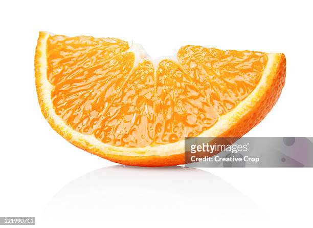 an orange segment - orange colour stock pictures, royalty-free photos & images