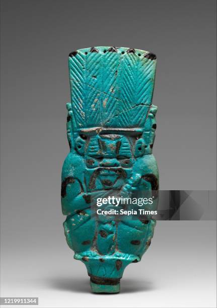 Bes rattle. Third Intermediate Period. Dynasty 22Ð25. Circa 945Ð664 BC. Faience. H. 21.6 cm . W. 8.6 cm . Th. 1.7 cm . This Bes-image represents the...