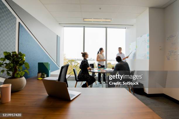 strategy team meeting - wide shot stock pictures, royalty-free photos & images