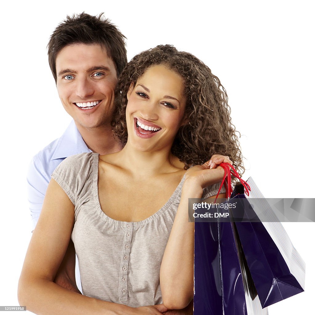 Affectionate Couple With Shopping Bags - Isolated