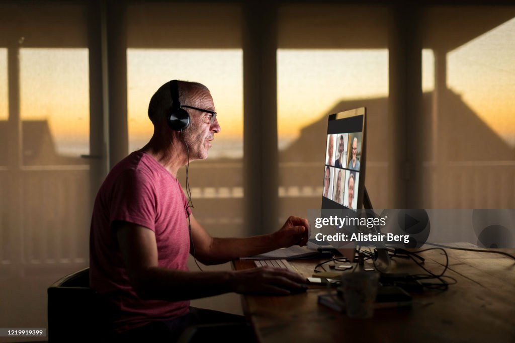 Businessman on video call to his family during lockdown