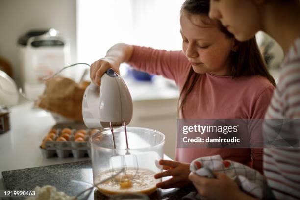 sisters cooking together at home - food processor stock pictures, royalty-free photos & images