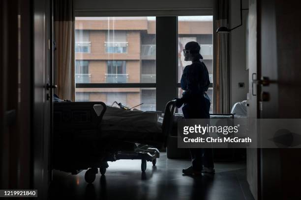 Nurse wearing personal protective equipment attends to a patient recovering from the COVID-19 virus in a dedicated COVID-19 ward at the Acibadem...