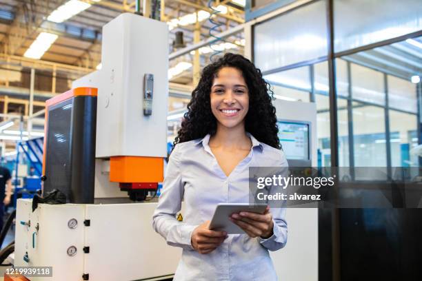 portrait of confident female engineer in factory - entrepreneur manufacturing stock pictures, royalty-free photos & images