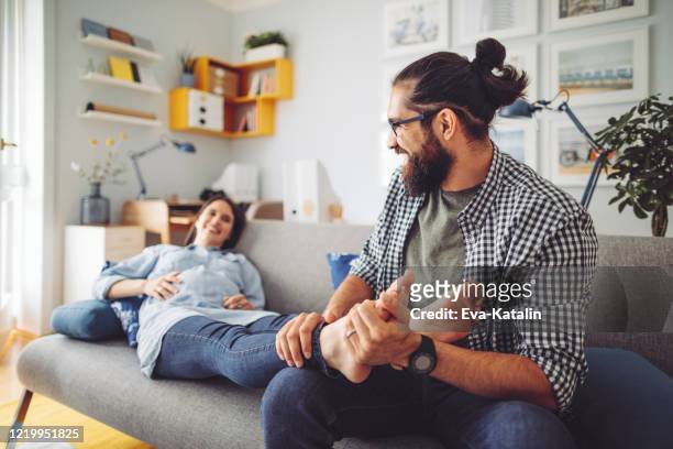 famiglia felice - man touching womans leg foto e immagini stock