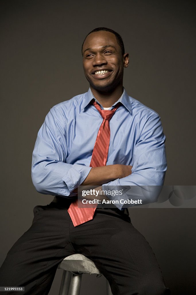 Man smiling in shirt and tie