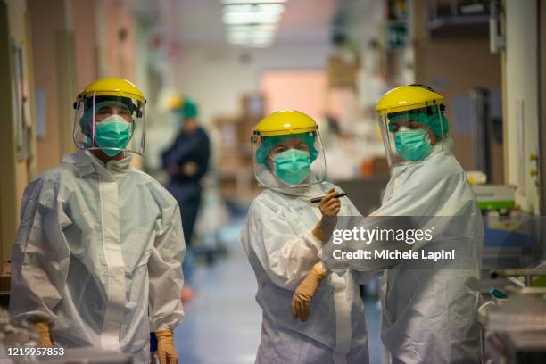 Medical staff write their names in protective suits to be recognized by their colleagues In the resuscitation and intensive care unit of the Covid-19...