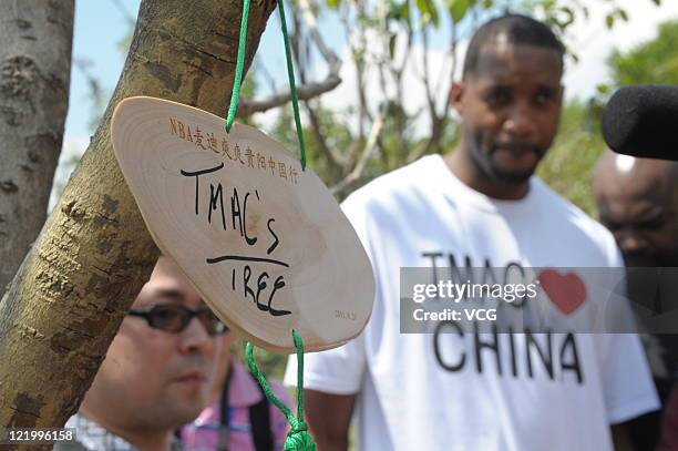 American professional basketball player Tracy McGrady of the Detroit Pistons attends a planting event on August 24, 2011 in Guiyang, Guizhou Province...