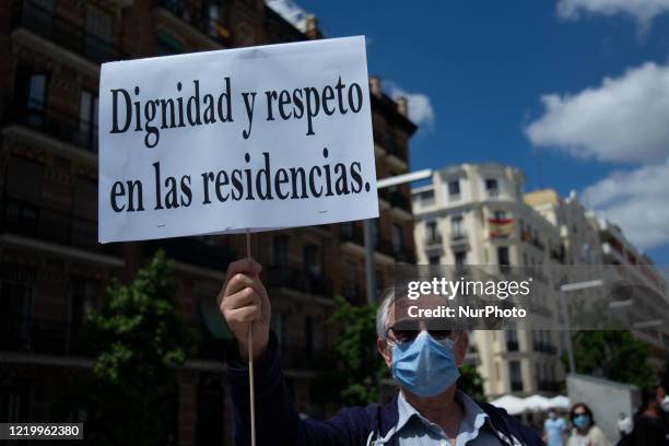 Protesters protest the management of the Spanish government of nursing homes during the pandemic of COVID-19 in Spain, in the Plaza de Dali in...