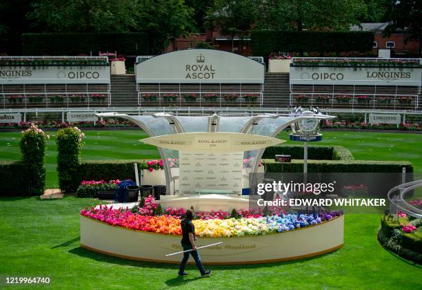 Rainbow of flowers adorns the front of the presentation podium on June 14 ahead of Royal Ascot 2020, due to take place at the racecourse, west of...