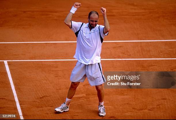 Andre Agassi of the United States celebrates victory during the 1999 French Open Final match against Andrei Medvedev of the Ukraine played at Roland...