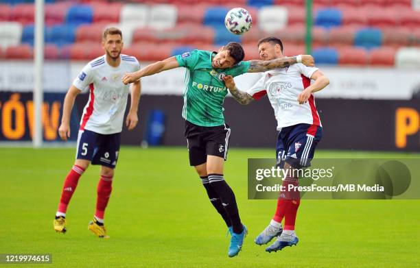 Pawel Wszolek of Legia Warszawa competes with Erik Janza of Gornik Zabrze during the PKO Ekstraklasa match between Gornik Zabrze and Legia Warszawa...