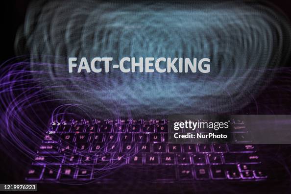 Fact Checking Sign 'Fact-checking' sign is seen displayed on a laptop screen in this ...