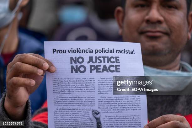 Protester holds a placard calling for an end to racist and police violence during the demonstration. Convened by the Union of Home and Care Workers,...