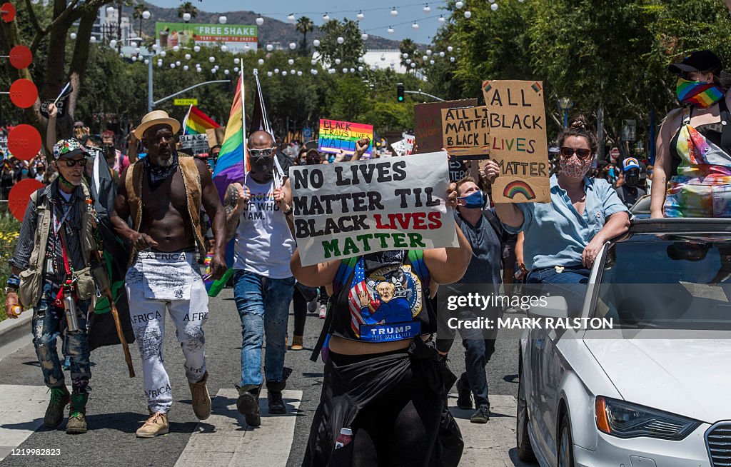 Minority Rights Rally Protesters hold signs and chant slogans at a rally and march against ...