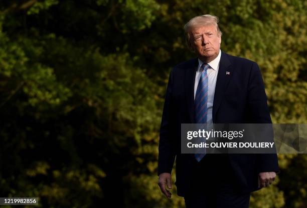 President Donald Trump walks off Marine One at the White House after spending the weekend at Bedminster, New Jersey on June 14, 2020 in Washington,...
