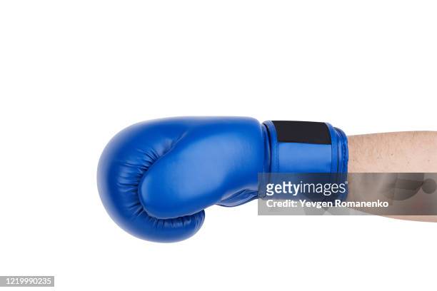 blue boxing glove on men's hand isolated on white - boxing media workouts fotografías e imágenes de stock