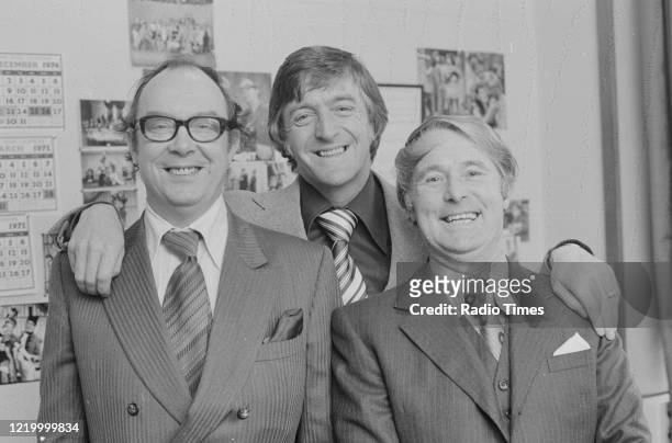 Comedians Eric Morecambe and Ernie Wise with broadcaster Michael Parkinson during filming for the BBC television show 'The Morecambe and Wise Show',...