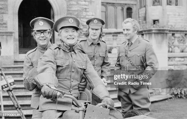 Comedians Eric Morecambe and Ernie Wise filming on location with actors Dennis Waterman and John Thaw for the BBC television series 'The Morecambe...