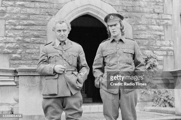 Actors Dennis Waterman and John Thaw filming on location for the BBC television series 'The Morecambe and Wise Show', Wimbledon, November 10th 1976.