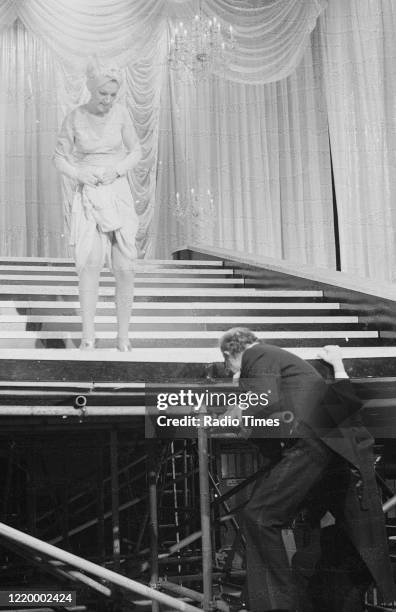 Comedians Eric Morecambe and Ernie Wise filming a performance with actress Penelope Keith for the Christmas special episode of the BBC television...