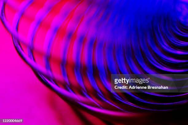 blue and fuchsia spinner - gel effect lighting stock pictures, royalty-free photos & images