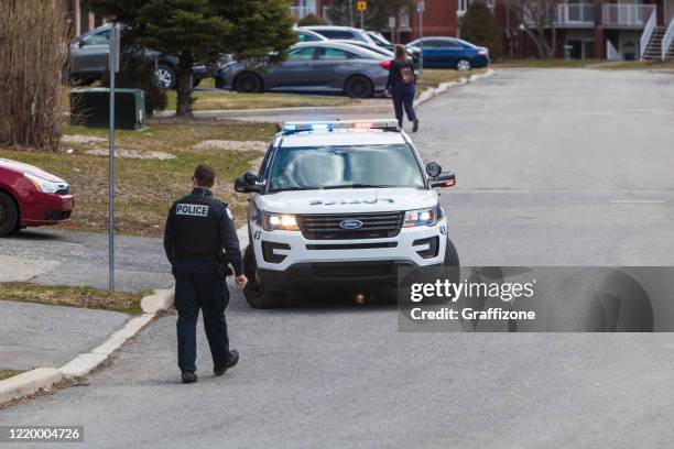 police car with police officer - police car stock pictures, royalty-free photos & images