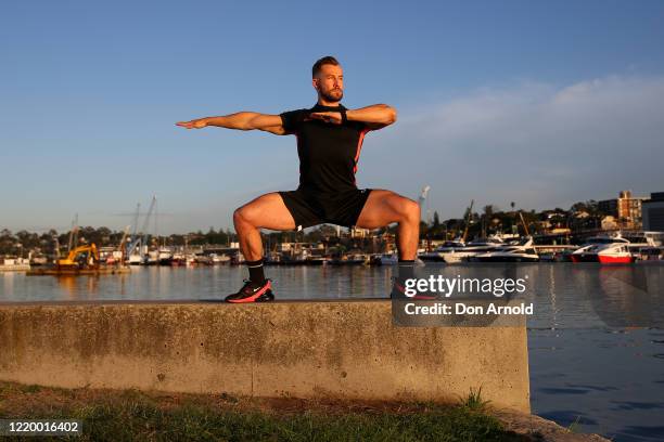 Dancer, instructor and musical theatre performer Heath Keating records a dance/fitness routine for his social media followers on the shoreline at...