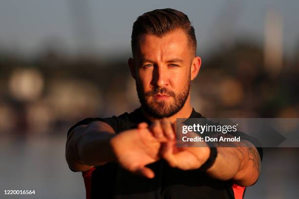 Dancer, instructor and musical theatre performer Heath Keating records a dance/fitness routine for his social media followers on the shoreline at...