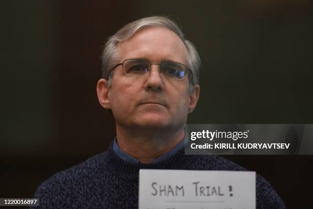 Paul Whelan, a former US marine accused of espionage and arrested in Russia in December 2018, stands inside a defendants' cage as he waits to hear...