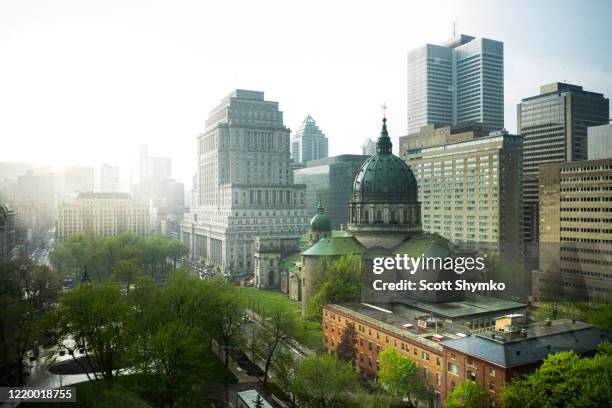 rain storm passes through downtown montreal, quebec - montréal fotografías e imágenes de stock