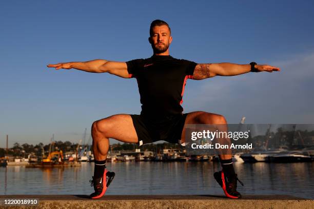 Dancer, instructor and musical theatre performer Heath Keating records a dance/fitness routine for his social media followers on the shoreline at...