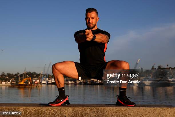 Dancer, instructor and musical theatre performer Heath Keating records a dance/fitness routine for his social media followers on the shoreline at...