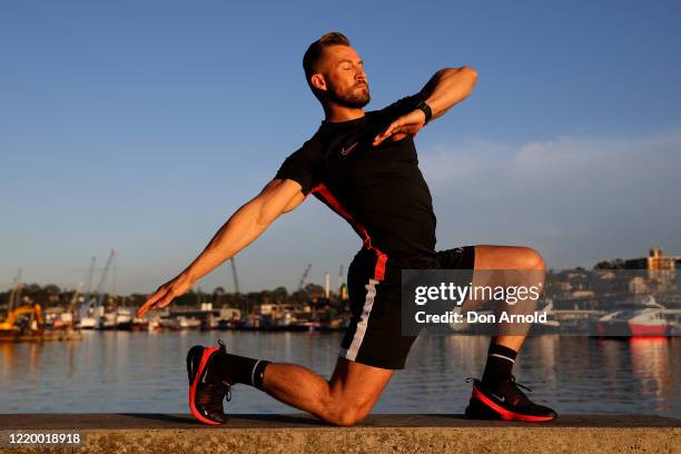 Dancer, instructor and musical theatre performer Heath Keating records a dance/fitness routine for his social media followers on the shoreline at...