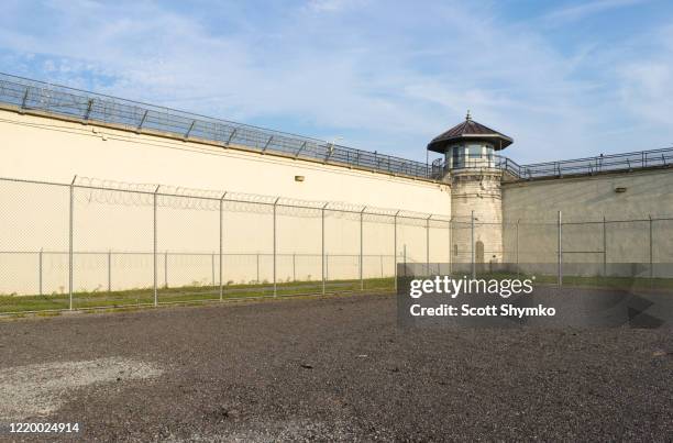 the exercise yard of a decommissioned prison - lookout tower stock-fotos und bilder