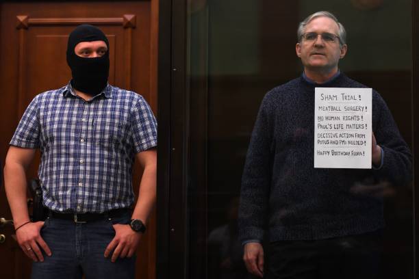 Paul Whelan, a former US marine accused of espionage and arrested in Russia in December 2018, stands inside a defendants' cage as he waits to hear...