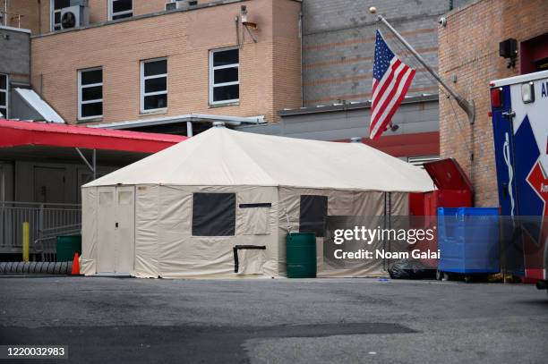 Temporary tent sits outside Elmhurst Hospital Center during the coronavirus pandemic on April 20, 2020 in New York City. COVID-19 has spread to most...