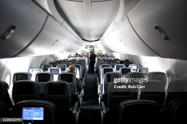 Flight attendant checks on passengers mid-flight on a Baltimore, Maryland bound Delta flight from Hartsfield-Jackson Atlanta International Airport on...